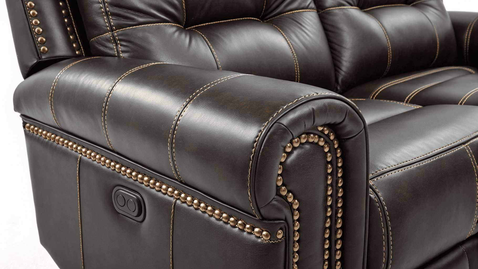 Close-up of brown leather recliner stitching and rivets