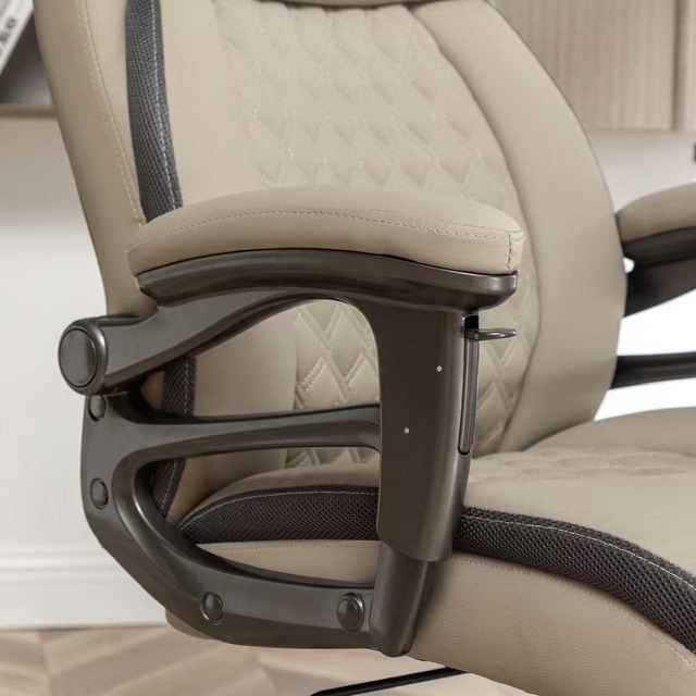adjustable armrest close-up on leather office chair
