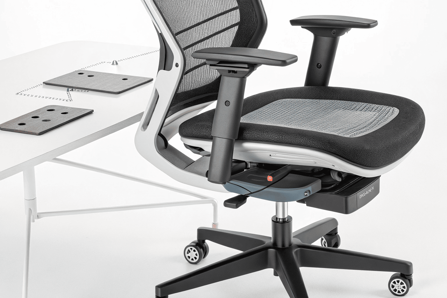 Close-up of ergonomic mesh office chair sample with mechanism